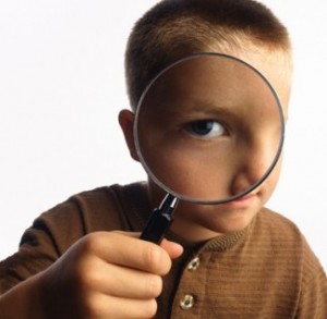 boy-with-magnifying-glass-325x318