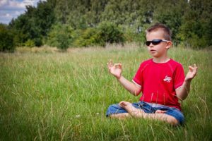 little boy mediating