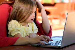 child reading with parent